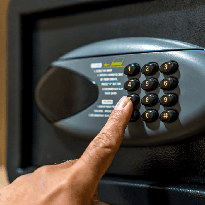Person opening a safe.